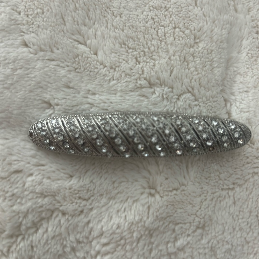 Rhinestone hair accessory.  2 rhinestones are missing.